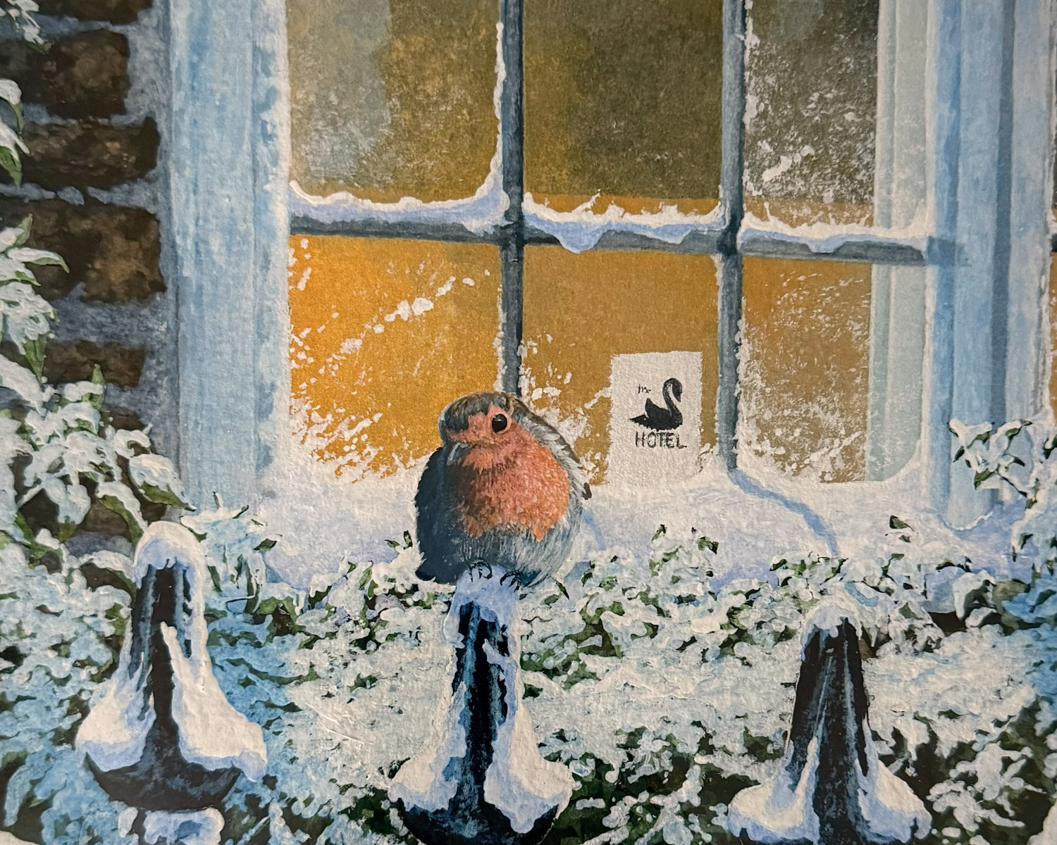 Robin Sitting on a Snowy Gate